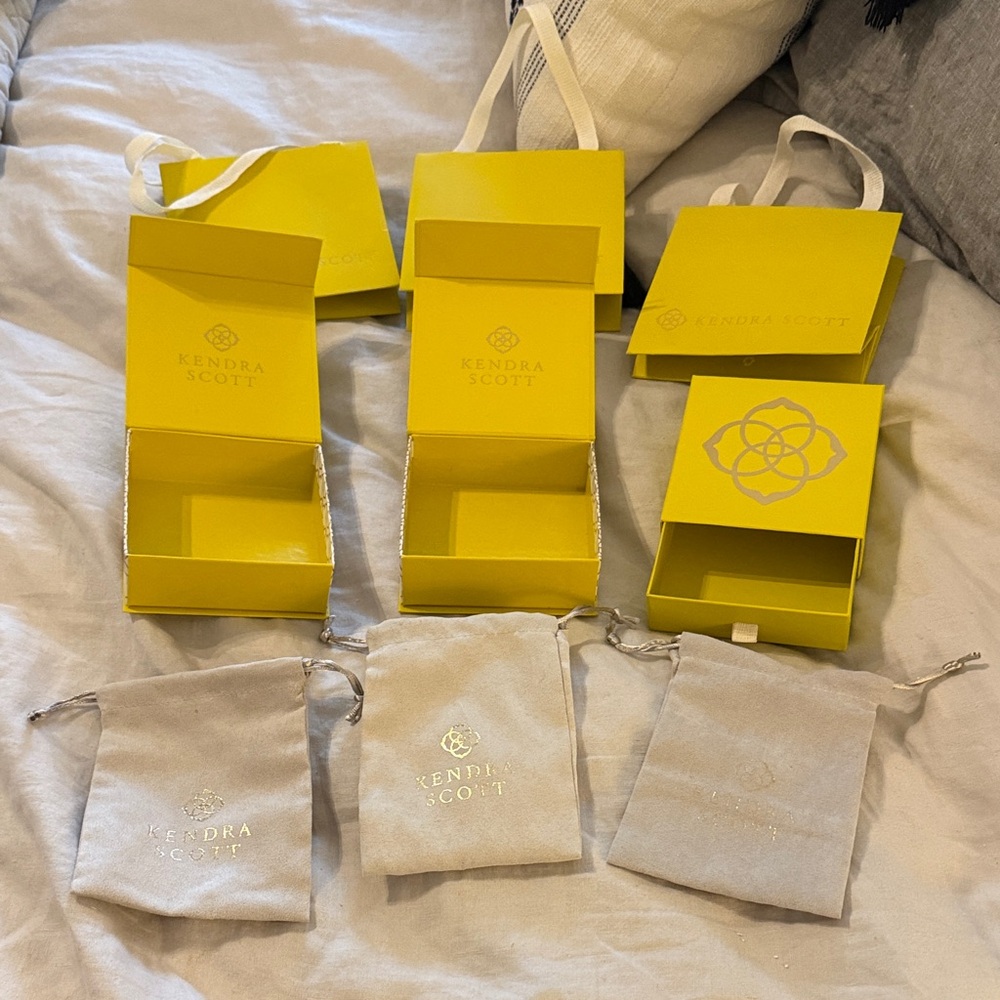 Kendra Scott Yellow Boxes and Gray Pouches